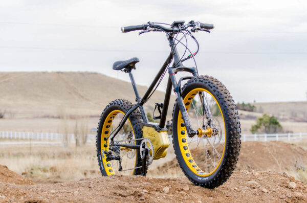SIMBB Fat Tire E-Bike on top of a dirt jump