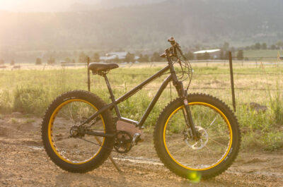 SIMBB Fat Tire E-Bike with mountain sunset in the background