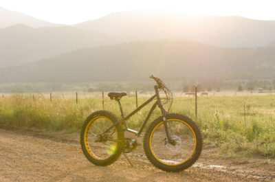 SIMBB Fat Tire E-Bike with mountain sunset in the background