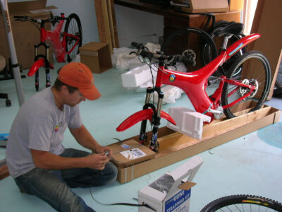 Optibike employee Craig finishing up the final touches on the First Optibike Produced in 2006