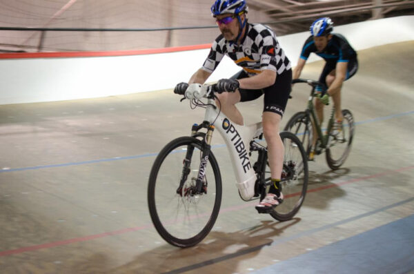 Velodrome Pacer Tim Kyer on an Optibike Electric Bike in the Boulder, CO Velodrome racing track