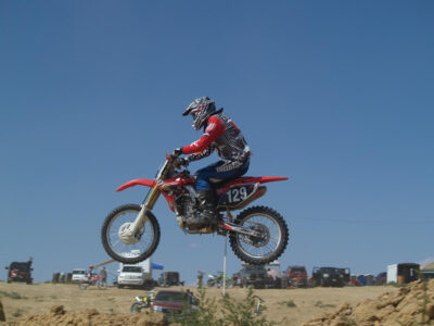 Jim Turner resumes motocross racing again after a 25 year retirement, and is seen here in mid air after going over a jump on a motocross track