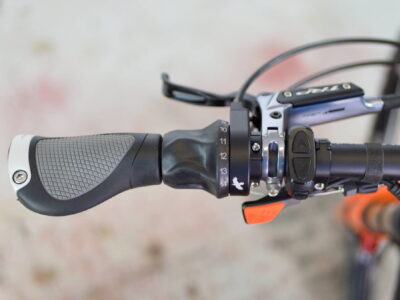 Left side of handlebar with Rohloff gear shifter, display controls, and seat post dropper lever