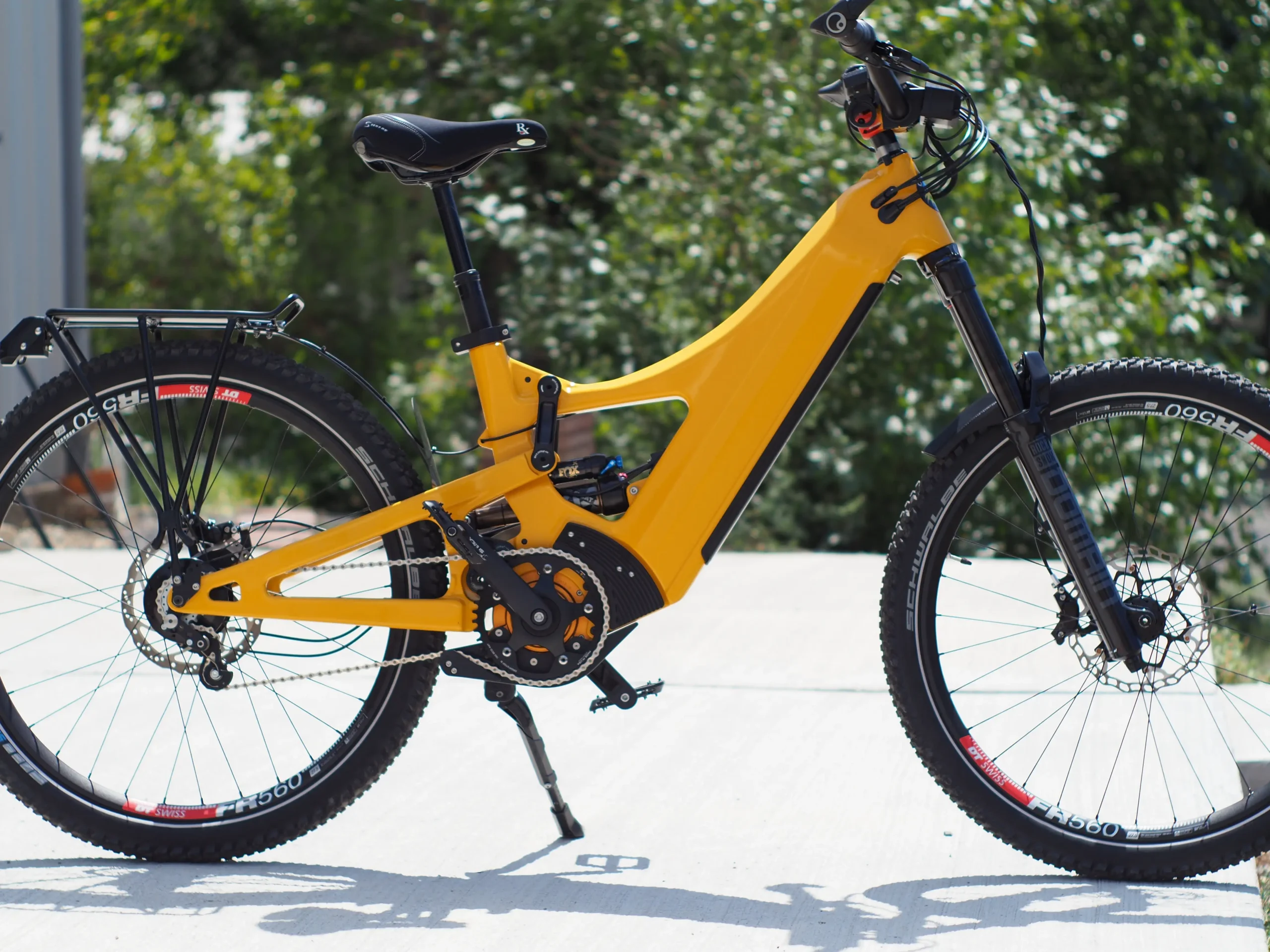 Yellow electric mountain bike on paved surface