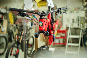 Red mountain bike being repaired in workshop