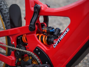 Red Optibike G Series electric mountain bike rear suspension close-up