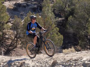 Man riding mountain bike on desert trail