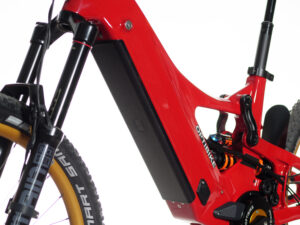 Red electric mountain bike with suspension system