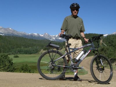 Bob Goddard with his Optibike in the Mountains