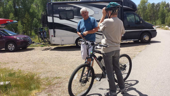 Rhonda with her Pioneer Allroad in front of her RV